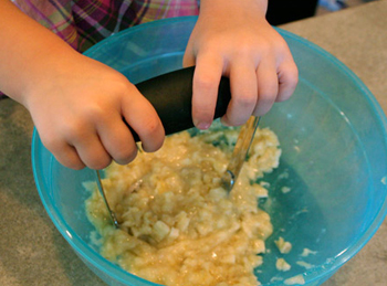 mashing bananas for banana bread