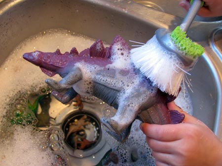 washing paint off dinosaurs