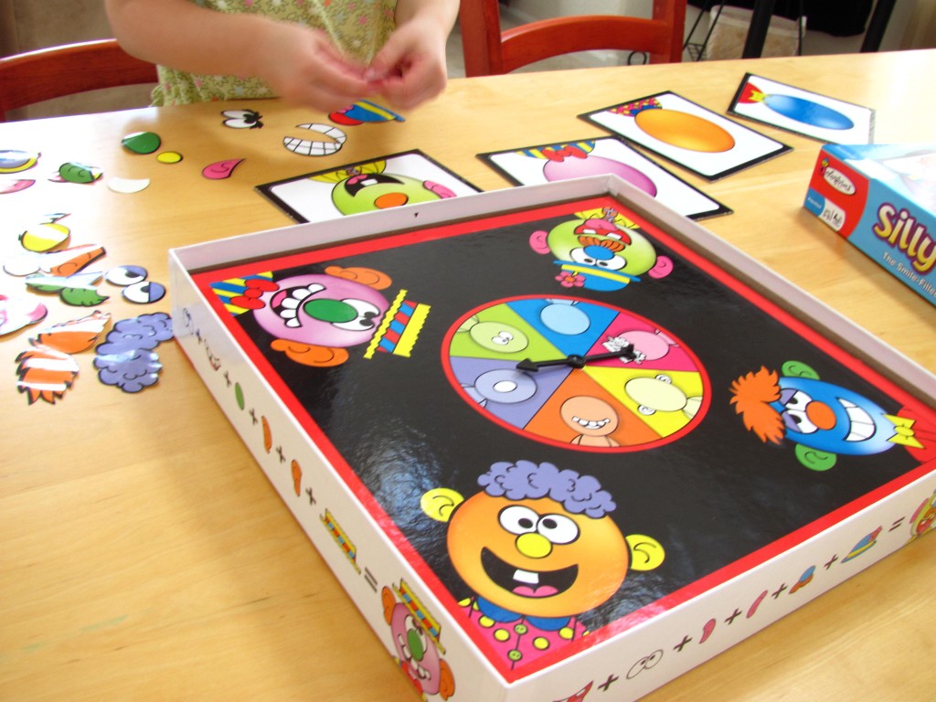 Playing Colorforms Silly Faces game Playing Colorforms Silly Faces game