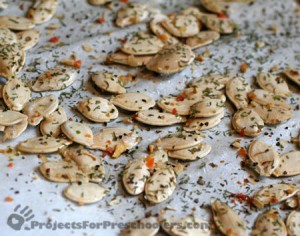 Toss in oil, spread on a cookie sheet, season and bake pumpkin seeds