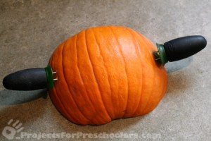 Stick corn holders into side of pumpkin stamp