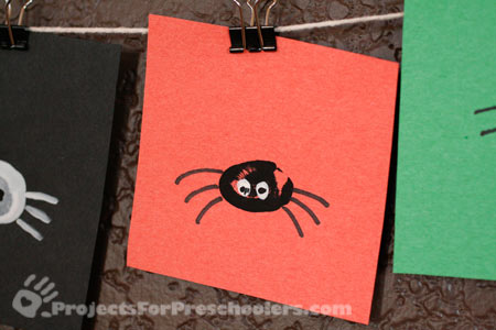 Make a thumbprint spider Make a thumbprint spider
