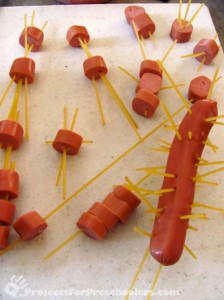 Add noodles to the hot dogs
