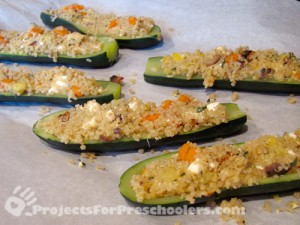 Fill the zucchini with Quinoa veggie mixture