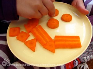 making a smiley face with cut carrots