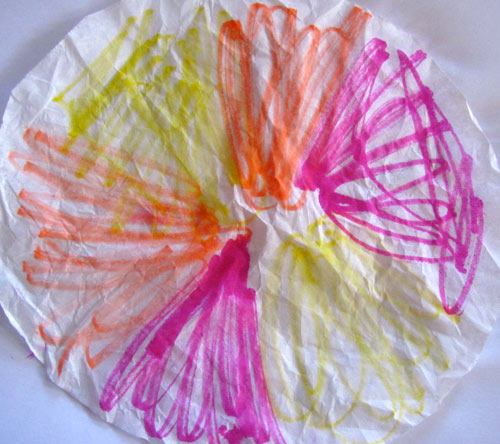 Color the coffee filter with washable markers