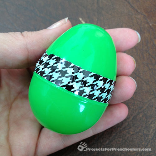 Finished plastic egg decorating with fun tape